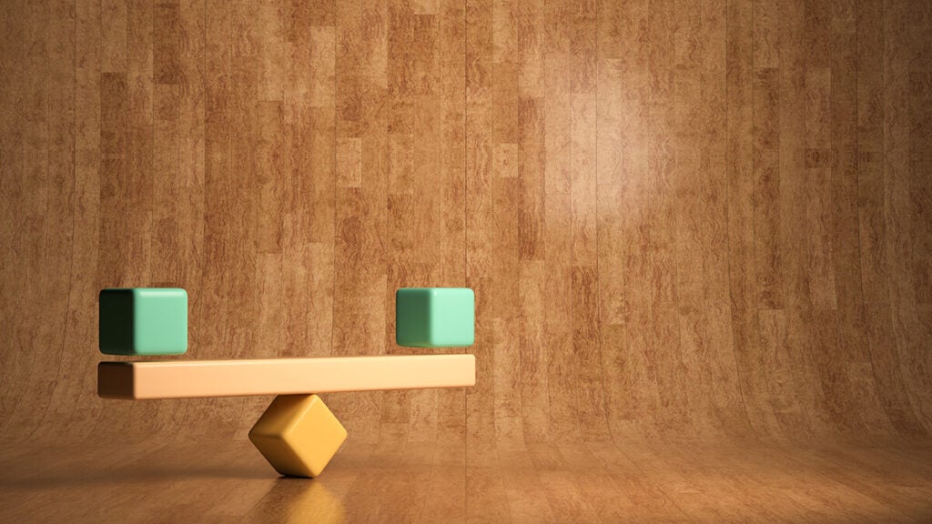 Balanced blocks on a scale representing comparing private equity options.